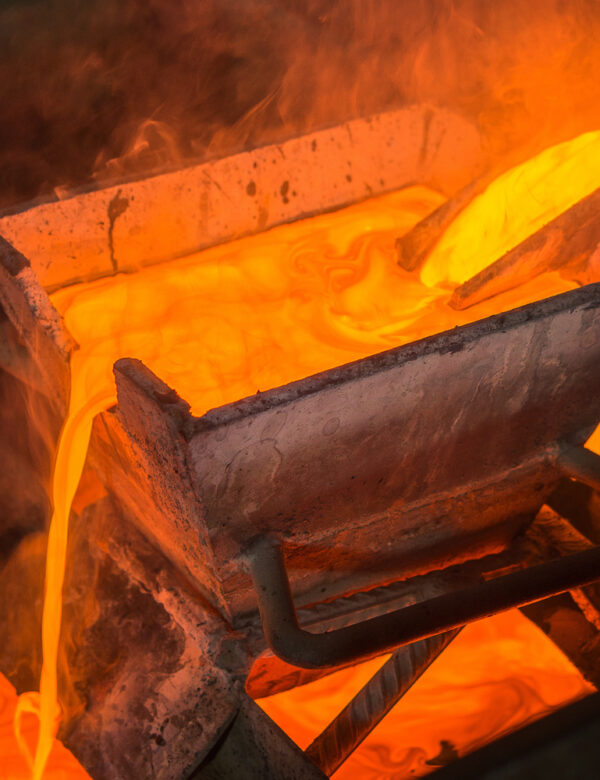Casting gold at a factory. Gold mining.