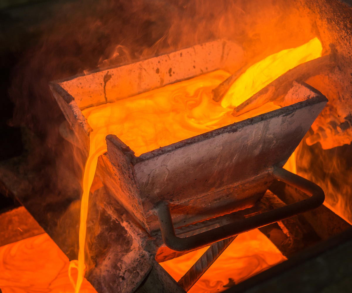 Casting gold at a factory. Gold mining.